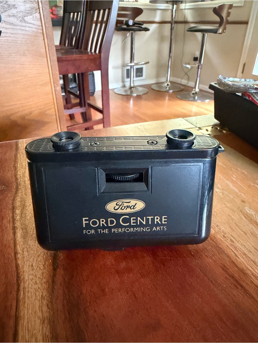 Ford black promotional viewer with gold logo